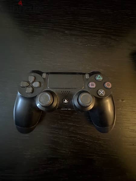 PlayStation 4 Slim 500GB with a controller 1