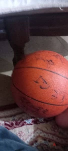 basketball singed by coach and players of sagess 1