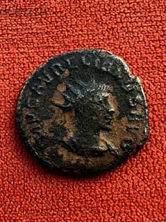 face from the front , face from the back . Roman coin