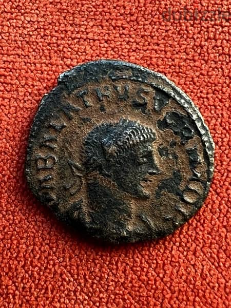 face from the front , face from the back . Roman coin 1