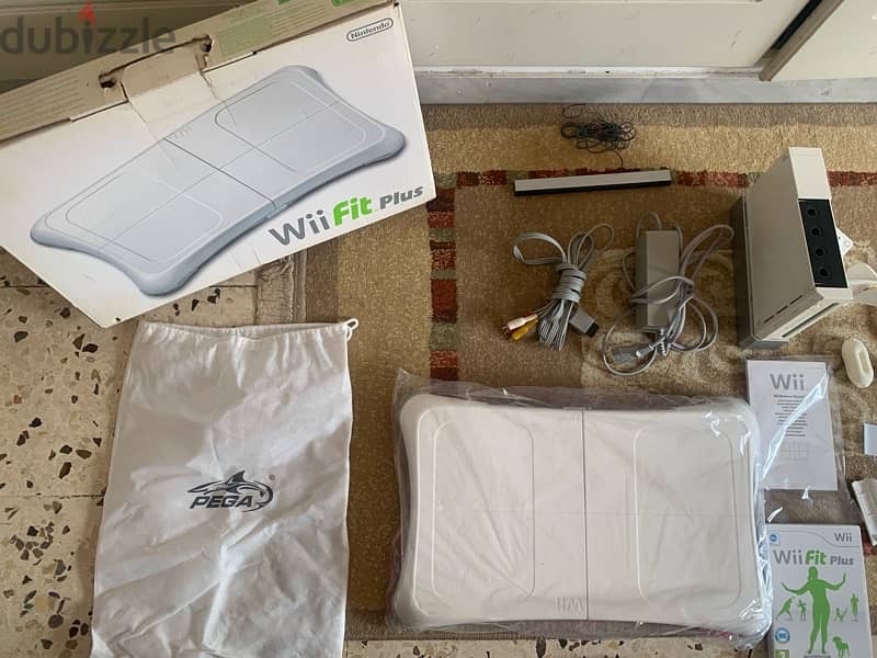 wii console+wii fit plus like new+many accessories more 18game 120$all 3