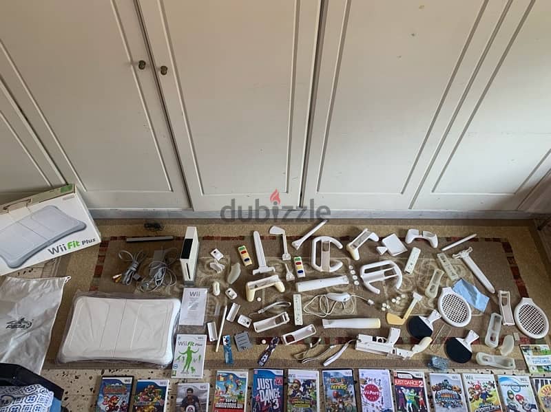 wii console+wii fit plus like new+many accessories more 18game 120$all 0
