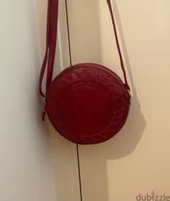 red faux leather purse