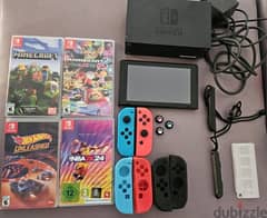 Nintendo switch with extra accessories, 4 games and bag