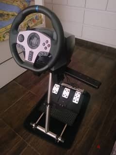 PXN steering wheel with pedals and stand and 2 cds
