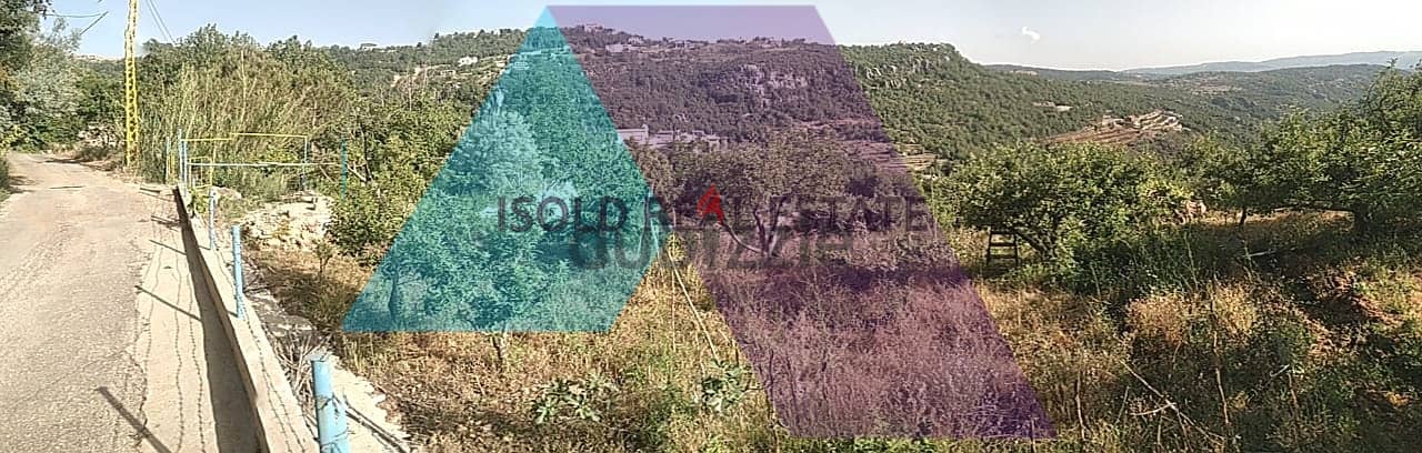 A 950 m2 land having an open mountain view for sale in Kfarzebian 1