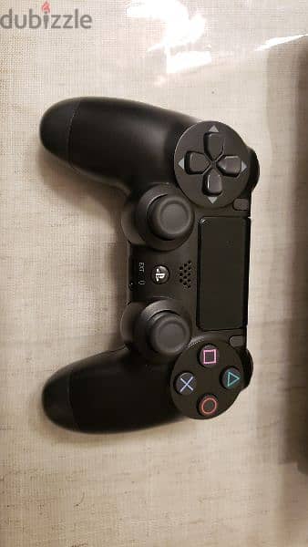 very clean ps4 with the original controller 3