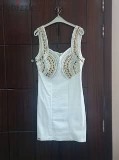 A short Dress with a good quality. Used only one time. Size 42