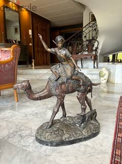 large bronze statue, arab hunter riding a camel
