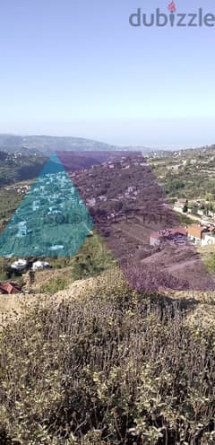 A 6900 m2 land having an open mountain view for sale in Fakra