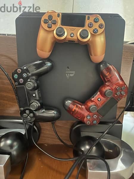 PS4 Slim with 3 controllers and C. O. D cd 1