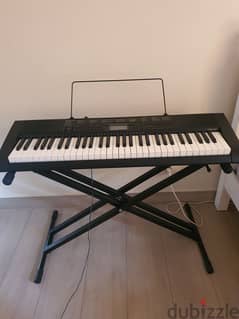 Casio CTK1100 piano keyboard with stand