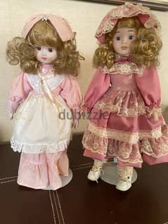 2 porcelain dolls and book, pre-owned