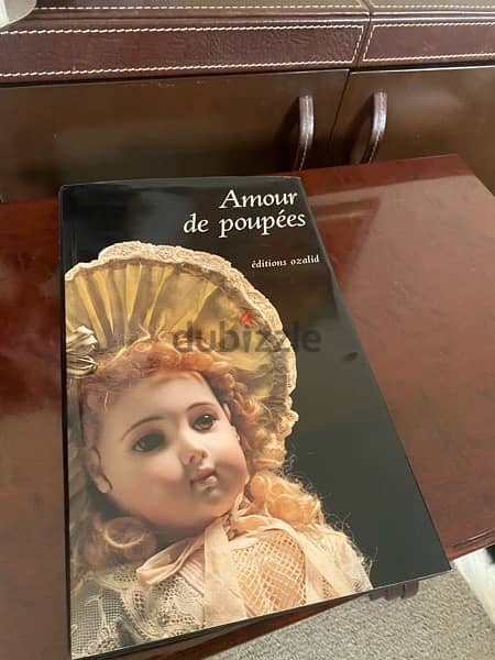 2 porcelain dolls and book, pre-owned 1