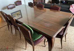 full dining room with 8 chairs and other dining room items