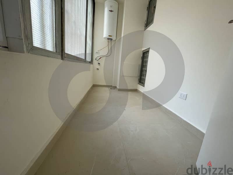 Catchy apartment fully renovated in hamra/الحمرا  REF#IK104548 4