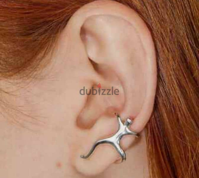 Silver skeleton and climbing man ear clip 2$ 2