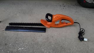 Garden Tool: Electric Hedge Trimmer.