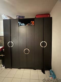 used closets for clothes has a doorway in the middle.