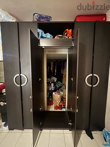 used closets for clothes has a doorway in the middle. 1