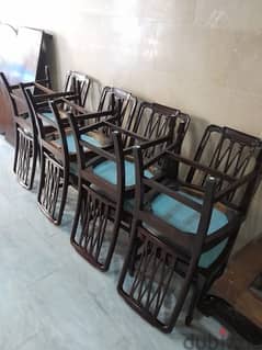 dining table adjustable and 8 chairs. 0