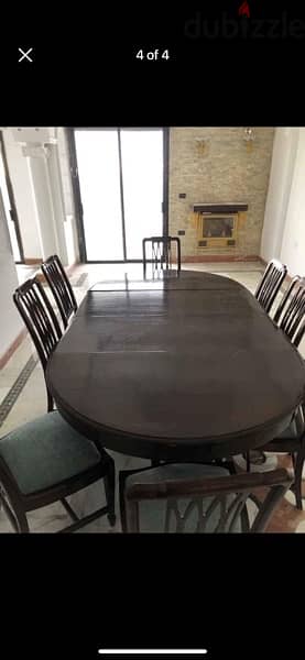 dining table adjustable and 8 chairs. 1