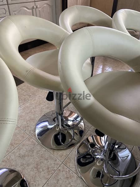 5 white leather chairs - used 2