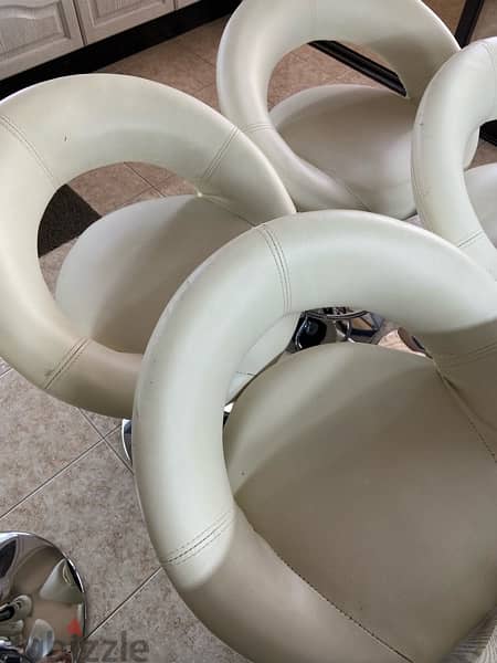 5 white leather chairs - used 3