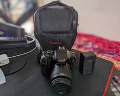 Canon 600D with kit lens 18-55mm and charge and bag