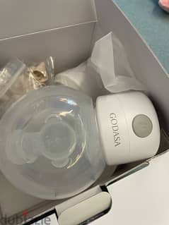 breast pump and milk warmer/ used for less than one month/ like new