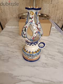 A ceramic hand painted candle holder