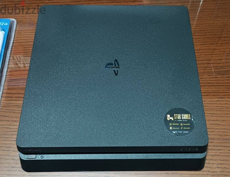 playstation 4 slim European with 2 controller all cables and one game 1