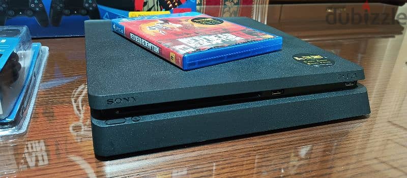 playstation 4 slim European with 2 controller all cables and one game 4
