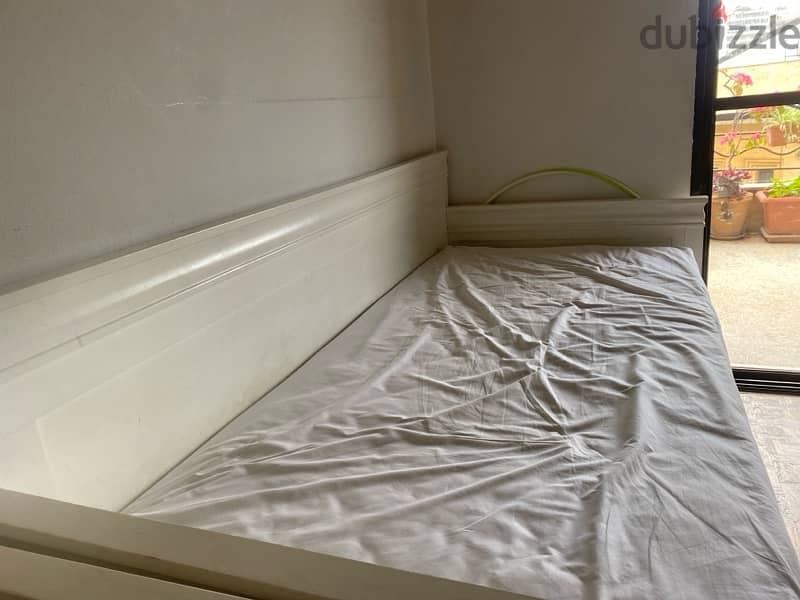 White bed without mattresse and a openable drawer 1