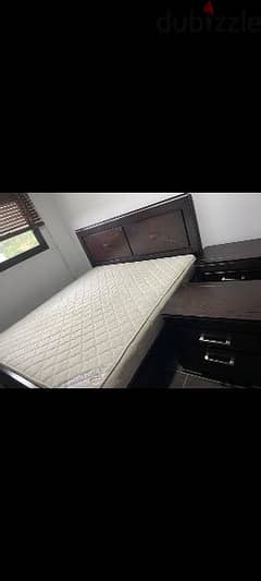 bed and matress and 2 night table
