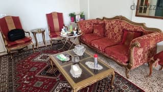 Full Salon with 2 chairs, 1 small table and 1 large table, with 1 sofa