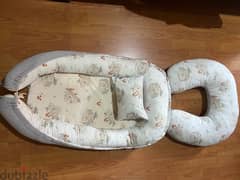 baby nest with small pillow and feeding pillow