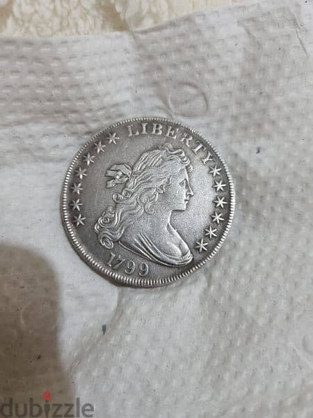 A silver old coin 7 dollars the gram 12