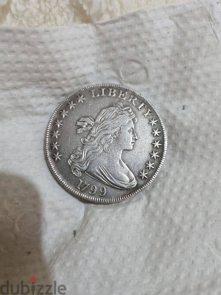 A silver old coin 7 dollars the gram 13