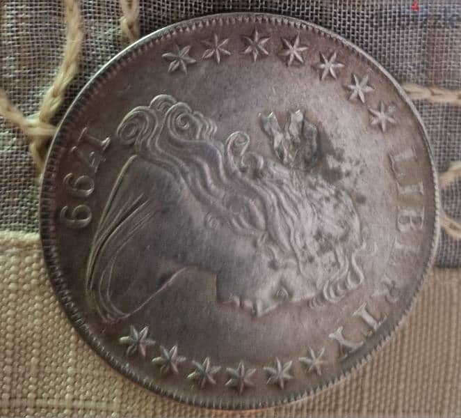 A silver old coin 7 dollars the gram 16