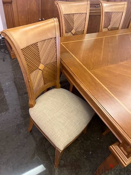 Wood dining table accompanied with 10 chairs in very good condition 2