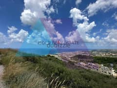 A 3200 m2 land having an open mountain/sea view for sale in Batroun