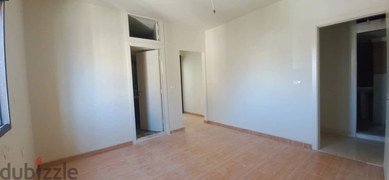 Newly Renovated Apartment with Spacious Balcony for Sale in Ballouneh 3