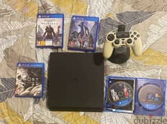 PlayStation 4 slim with four games and a controller