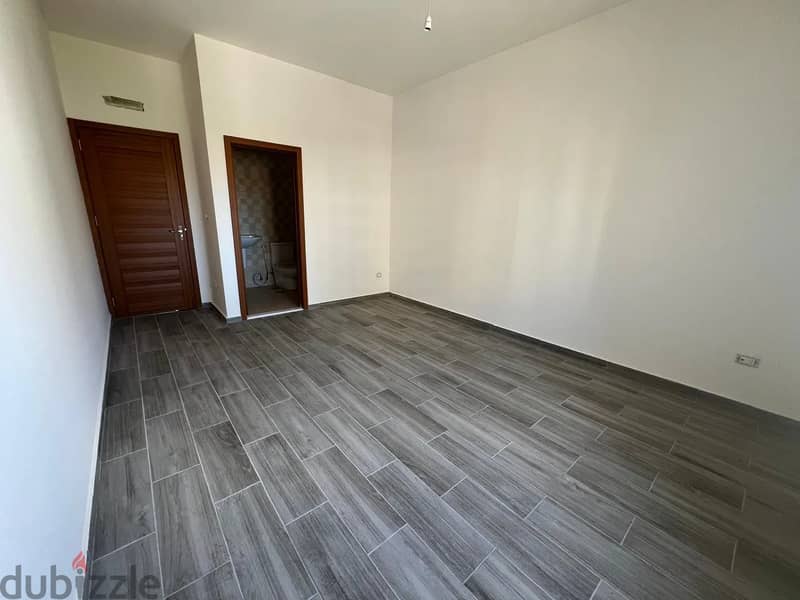 Spacious 4-Bedroom Apartment in a Prime Location in Bahsas for Sale 8