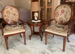 2 chairs with table and lamp