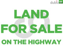 LAND FOR SALE IN BALLOUNEH ON THE HIGHWAY ! REF#SE01000!