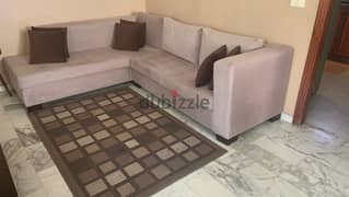 L shaped sofa and carpet