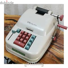 Vintage Olympia calculator 
ألة حاسبة انتيك