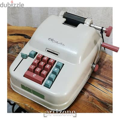 Vintage Olympia calculator 
ألة حاسبة انتيك